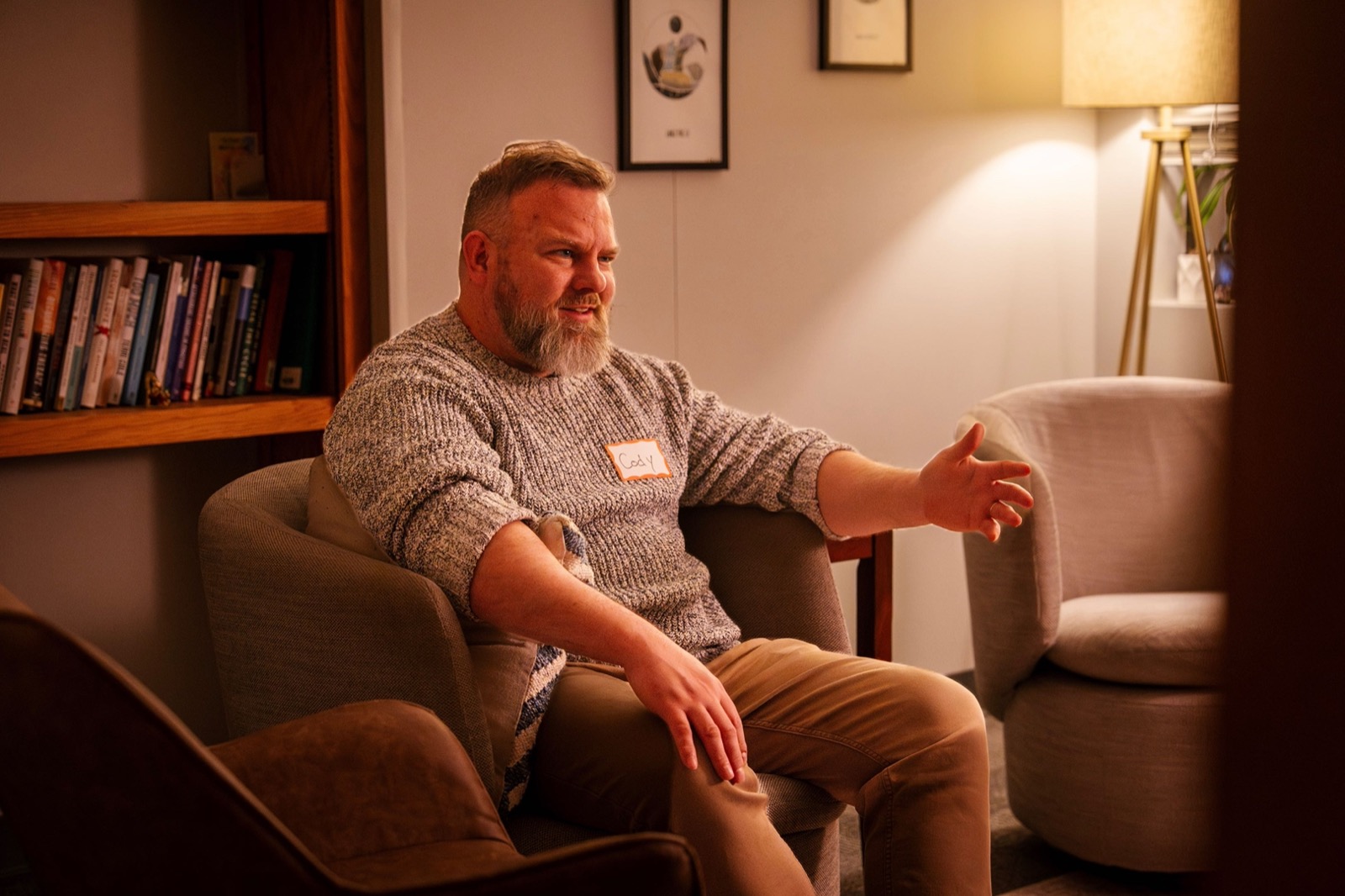 Cody Robertson in a warm mentorship conversation setting